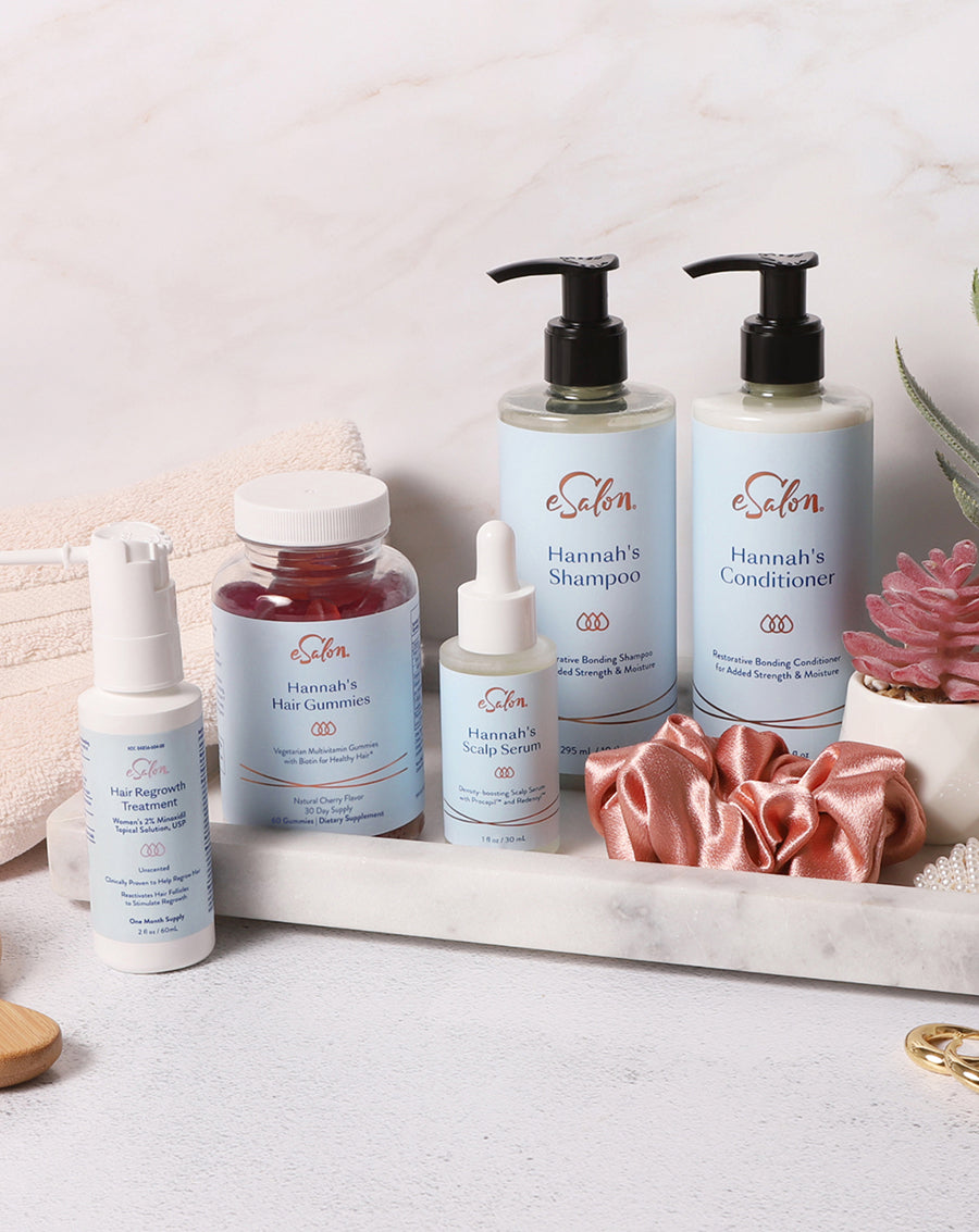 The full eSalon custom hair growth routine arranged on a bathroom tray